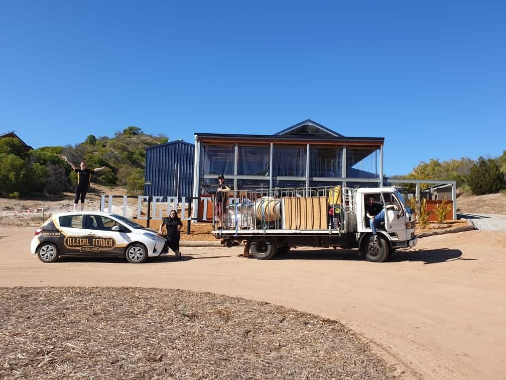 Distillery building with truck and car