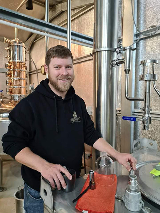 Image of man at Illegal Tender Rum Co's distillery.